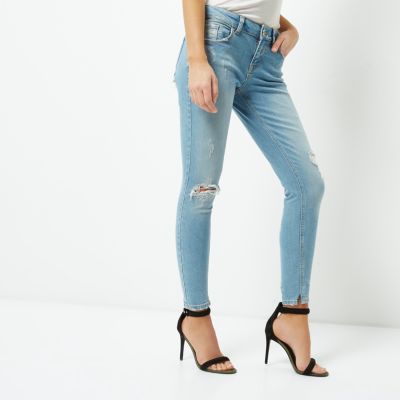 Light blue ripped relaxed skinny fit jeans